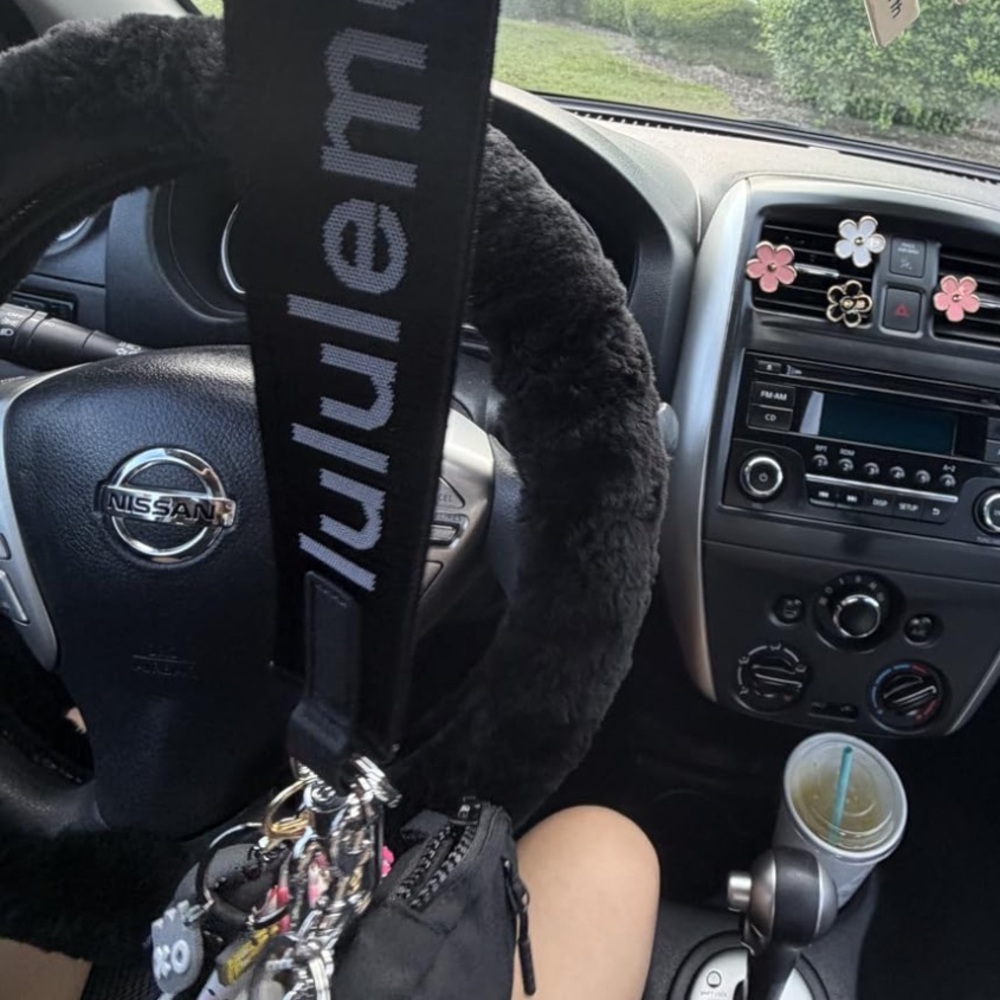 Real wool/sheepskin black sterring wheel cover. LOVE it keeps hands cool or warm
